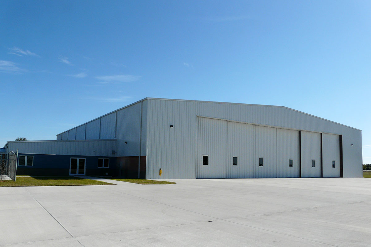Baer Air Charter’s 24,500-sq-ft metal building hangar at Melbourne International Airport features massive 28-ft-tall doors.